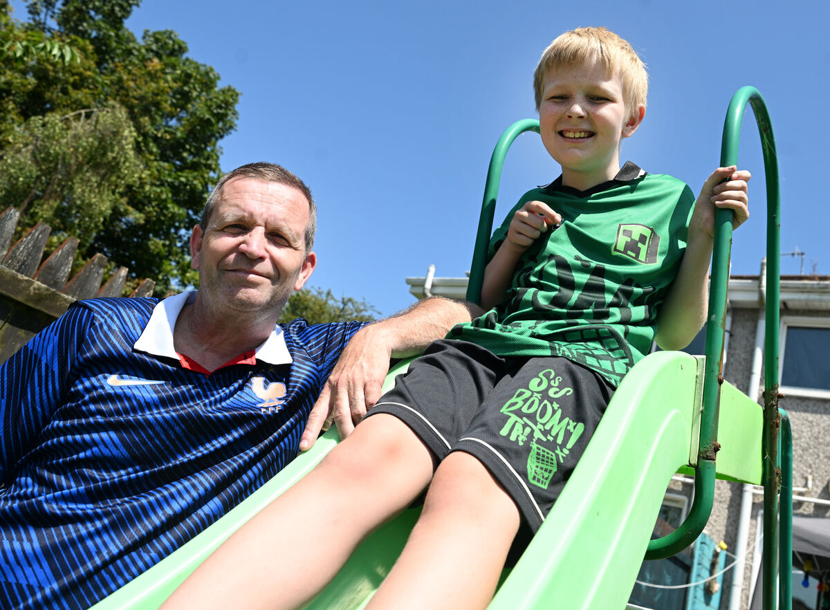 Kye playing in the garden with his dad Terry. 