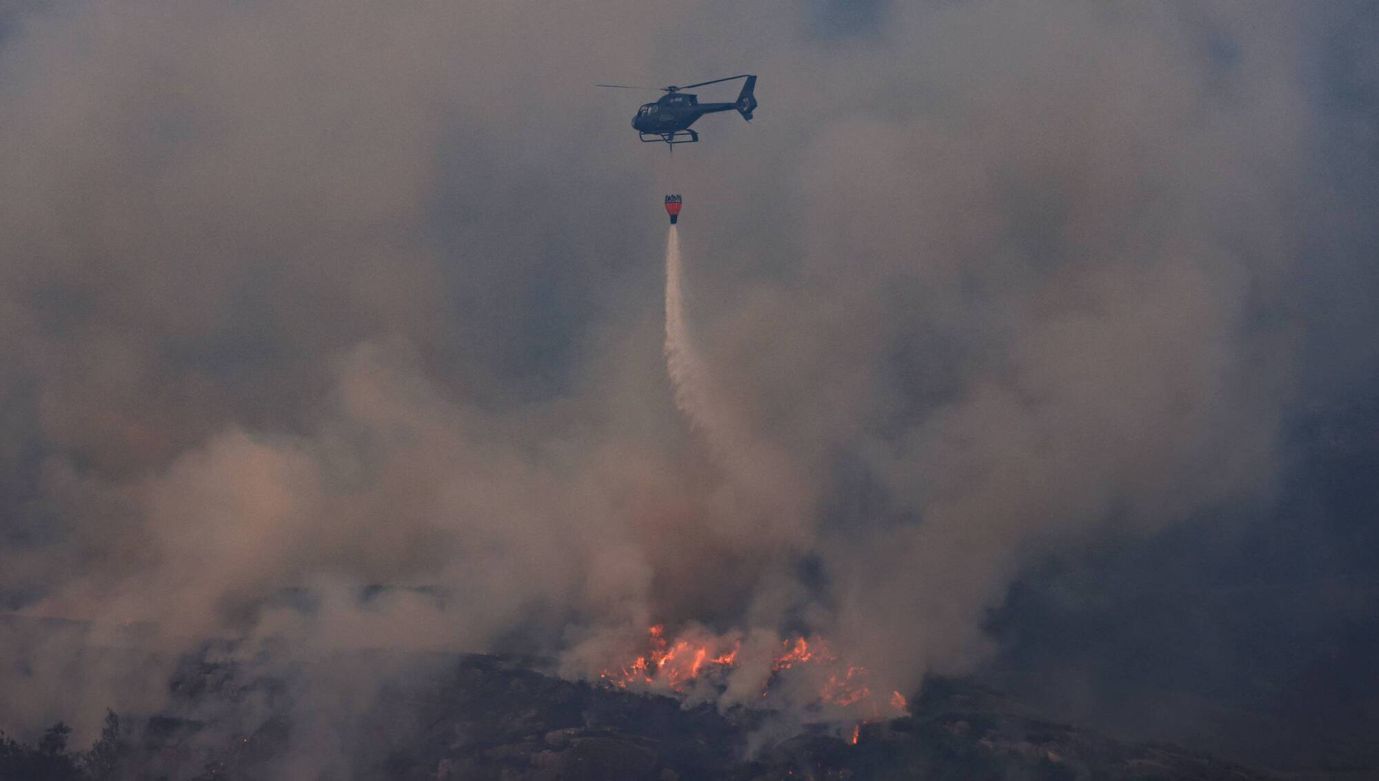 A wildfire in Killarney National Park last week. Heatwaves, wildfires and floods are again hitting populations around the globe and in Ireland. Photo: Valerie O'Sullivan/NPWS