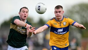 <p>Tadhg Morley of Kerry in action against Brendy Rouine of Clare during the Munster GAA Football Senior Championship semi-final match between Kerry and Clare at Zimmer Biomet Páirc Chíosóg in Ennis, Clare. Photo by Paul Phelan/Sportsfile</p> <p>Tadhg Morley of Kerry in action against Brendy Rouine of Clare during the Munster GAA Football Senior Championship semi-final match between Kerry and Clare at Zimmer Biomet Páirc Chíosóg in Ennis, Clare. Photo by Paul Phelan/Sportsfile</p>