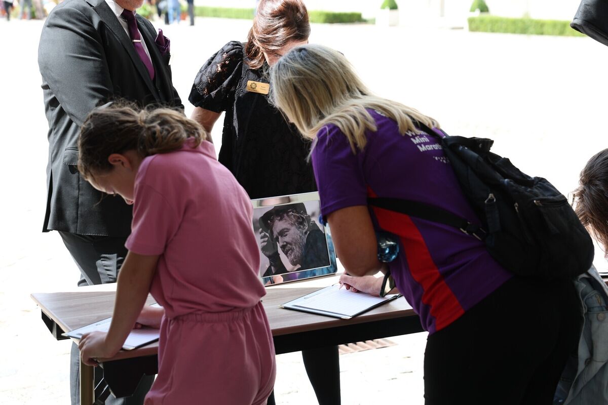 People signing condolence books at a public wake for Glen Hansard. Photo: Damien Eagers/PA Wire