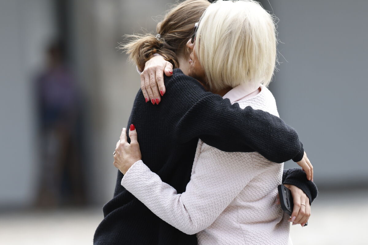 People hug whilst queueing to attend a public wake for Glen Hansard at the Irish Museum of Modern Art (IMMA) in Dublin. The Oscar-winning Irish musician and activist died in a motorcycle crash last week. Photo: Damien Eagers/PA Wire