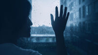 sad lonely depression mood woman silhouette touch glass windows rainy dark day outside