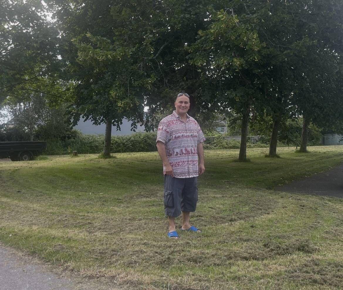 Ali Hamou on the green by his new home. He and his wife Rad were tenants in the St Finbarr’s Rd flats for eight years where they lived with dampness, water coming down the walls, black mould and an infestation of rats and mice. Picture: Donal O'Keeffe