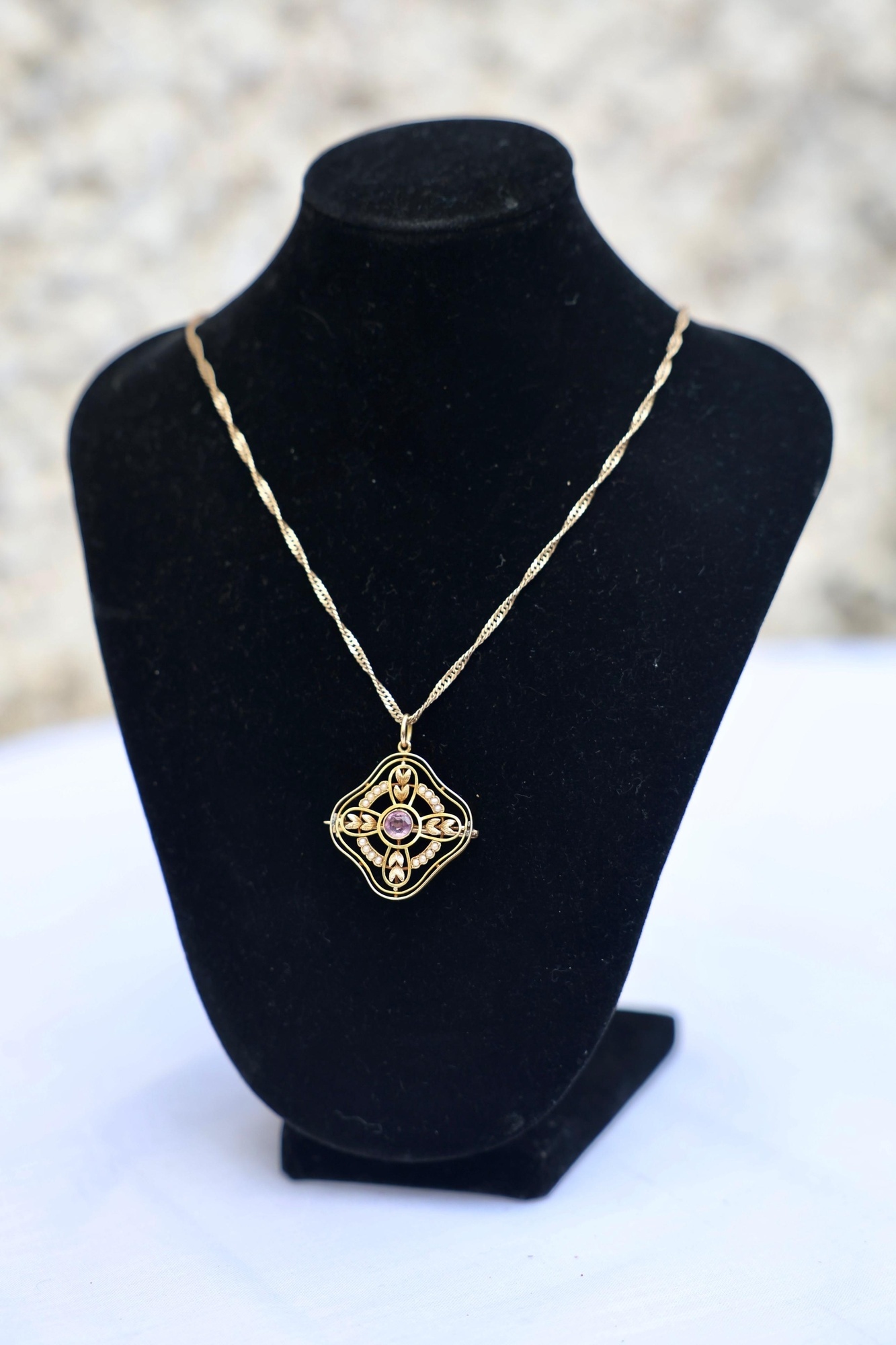  A c1900 pink tourmaline and half-pearl brooch pendant. 