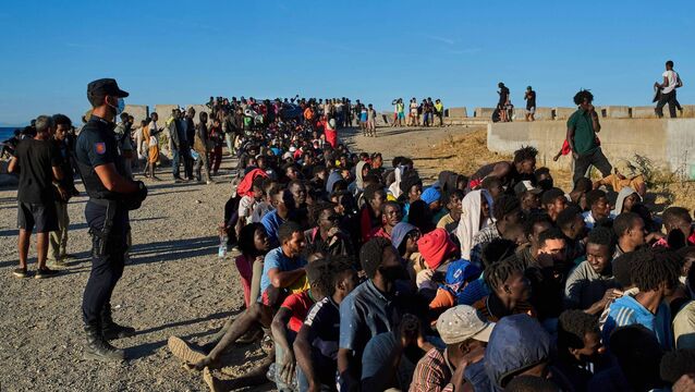 <p>Migrants who crossed from Morocco into Spain line up for food distribution on a beach in the Spanish enclave of Ceuta, Monday, Aug. 3, 2026. (AP Photo/Bernat Armangue)</p>