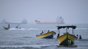 Small boats line the shore as cargo ships and other commercial vessels appear anchored in the Strait of Hormuz off Bandar Abbas, Iran (Razieh Poudat/ISNA/AP) Small boats line the shore as cargo ships and other commercial vessels appear anchored in the Strait of Hormuz off Bandar Abbas, Iran (Razieh Poudat/ISNA/AP)