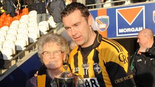 <p>Oisin McConville celebrates with his mother Margaret McConville after Crossmaglen Rangers won the 2011 Armagh SFC final. Pic: Oliver McVeigh / SPORTSFILE</p>