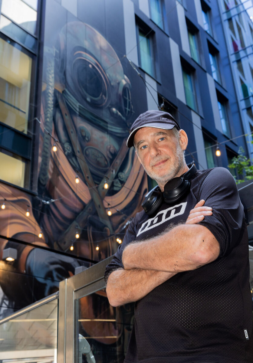 Street artist Shane Sutton with his street art in the background at the Travelodge Plus on Townsend Street, Dublin Picture: Gareth Chaney Street artist Shane Sutton with his street art in the background at the Travelodge Plus on Townsend Street, Dublin Picture: Gareth Chaney
