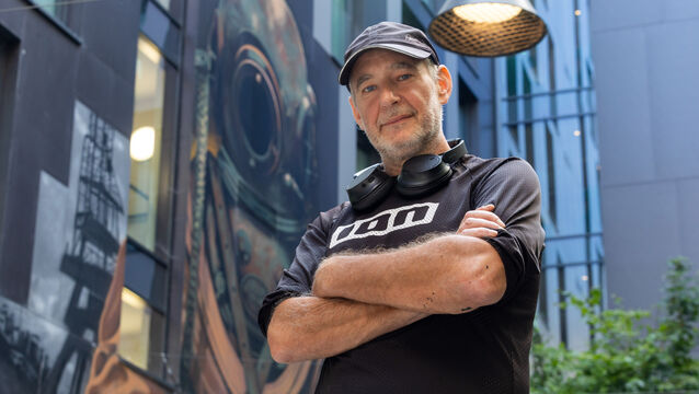 <p>Street artist Shane Sutton with his street art in the background at the Travelodge Plus on Townsend Street, Dublin Picture: Gareth Chaney</p>