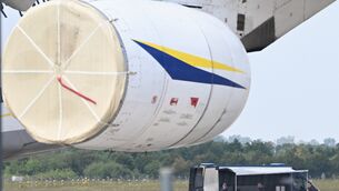 Police forensic technicians prepare to deploy an explosive-disposal robot near a Ukrainian aircraft at Leipzig/Halle Airport (Hendrik Schmidt/dpa via AP)