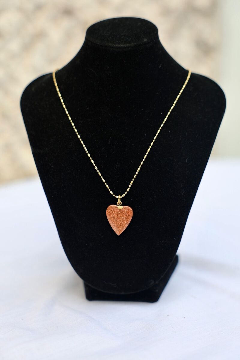 The heart-shaped pendant. The heart-shaped pendant.