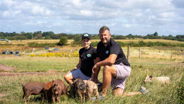 <p>Tadhg and Patrick Twomey feeding free-range piglets at Glenbrook Farm, which Patrick runs with his wife Kate. Picture: Noel Sweeney</p>