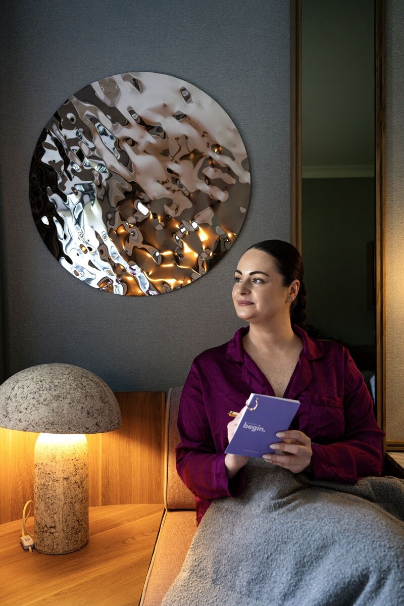 Breda makes notes as she reviews a selection of popular wellness treatments and products. 