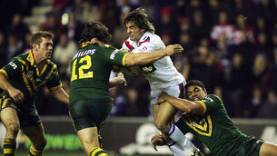 <p>POWERHOUSE: Brian Carney of Great Britain is stopped by Nathan Hindmarsh of Australia during the Gillette Tri-Nations match between Great Britain and Australia at the JJB Stadium in 2004. Picture: Clive Mason/Getty Images</p>