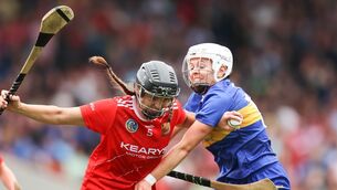 <p>MAKING AN IMPRESSION: Cork's Ava Fitzgerald is challenged by Clodagh McIntyre of Tipperary. Picture: INPHO/Tom Maher</p>