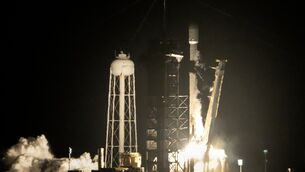 A SpaceX Falcon 9 rocket lifts off from pad 39A with a payload of a pair of lunar landers at the Kennedy Space Centre in Cape Canaveral, Florida, in 2025 (John Raoux/AP)