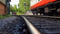 An old English passenger train and the rails receding into the distance. Pickering station.