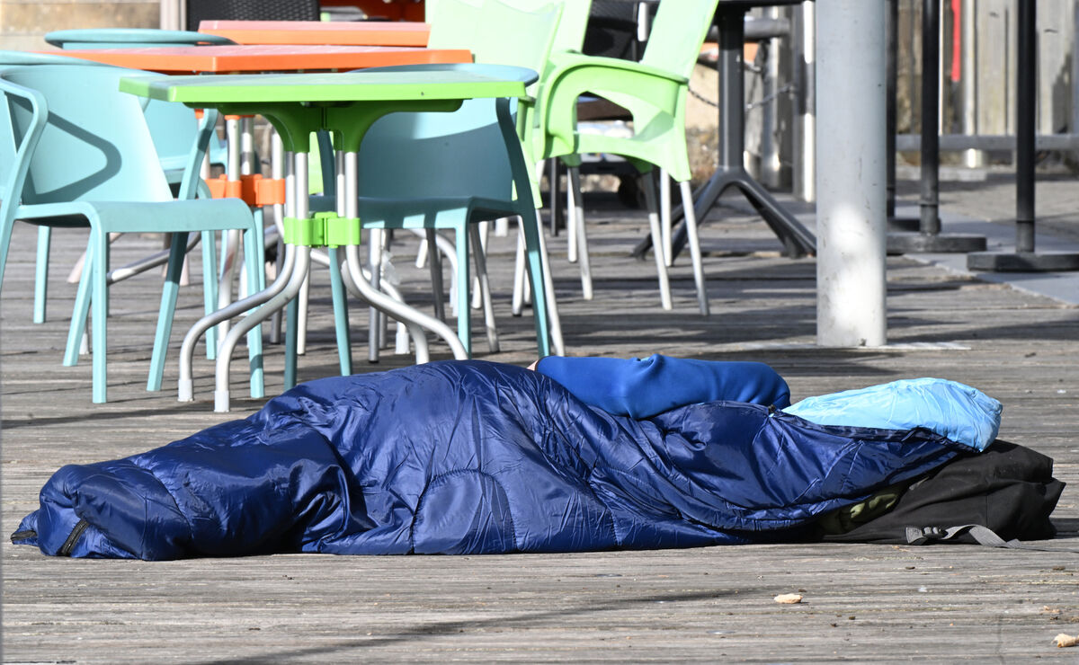 A rough sleeper in a sleeping bag near the cafes on the boardwalk on Lapp's Quay, Cork City. Picture: Larry Cummins A rough sleeper in a sleeping bag near the cafes on the boardwalk on Lapp's Quay, Cork City. Picture: Larry Cummins