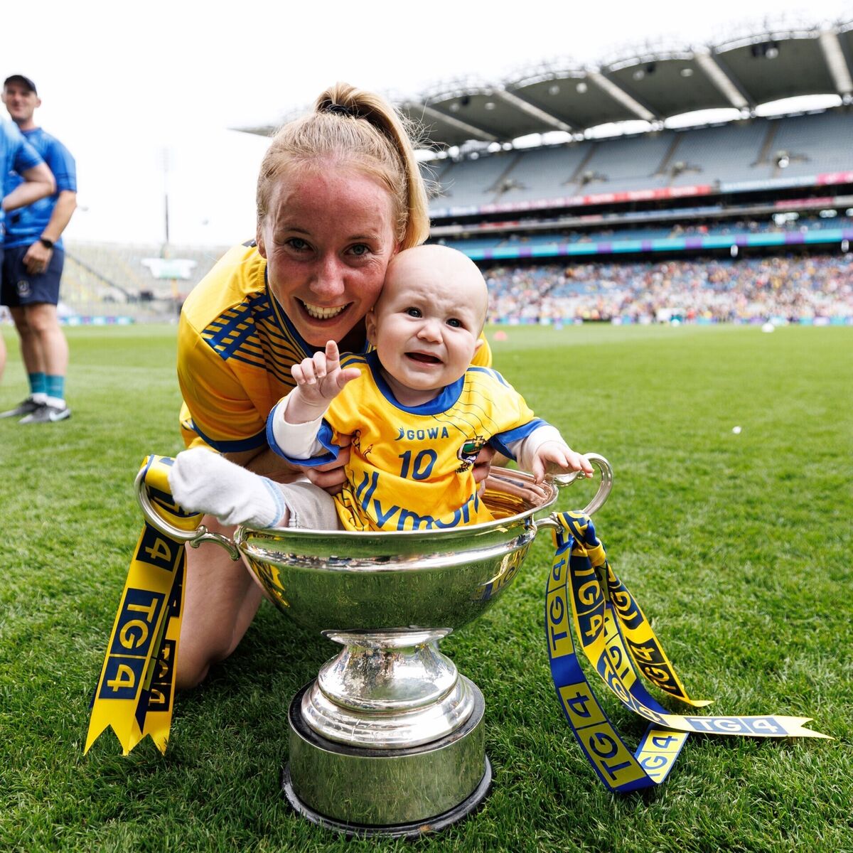 Roscommon's Laura Mannion with her son Eanna, aged 6 months in the Mary Quinn Memorial Cup after winning. Pic: ©INPHO/Ben Brady