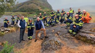 <p>Nature and biodiversity minister Christopher O’Sullivan in Killarney National Park with the fire crew who tackled the recent wildfire and NWPS staff. Picture: Valerie O'Sullivan</p>