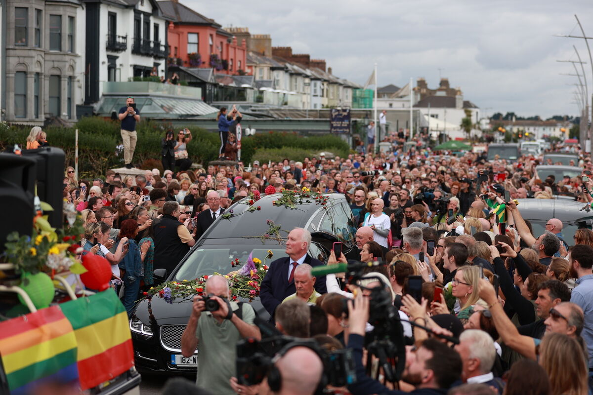 People lining the streets of Bray, Co Wicklow for a 'last goodbye' to Sinéad O'Connor ahead of a private burial service on August 8, 2023. Picture: PA People lining the streets of Bray, Co Wicklow for a 'last goodbye' to Sinéad O'Connor ahead of a private burial service on August 8, 2023. Picture: PA