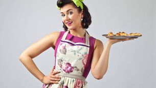 <p>A typical trad wife 'with an impossibly tiny waist and a gingham apron who, having crafted a gourmet meal for Himself, rushes off to make up her face because that’s the least the main breadwinner should expect.' Picture: iStock</p>