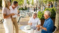 sex file holiday sex Feelgood.jpg Senior friends enjoying coffee and laughing at outdoor cafe