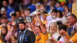 <p>Antrim captain Caitríona Graham lifts the Jack McGrath Cup after her side's victory in the Glen Dimplex All-Ireland Intermediate Camogie Championship final match between Antrim and Laois at Croke Park in Dublin. Pic: Piaras Ó Mídheach/Sportsfile</p>