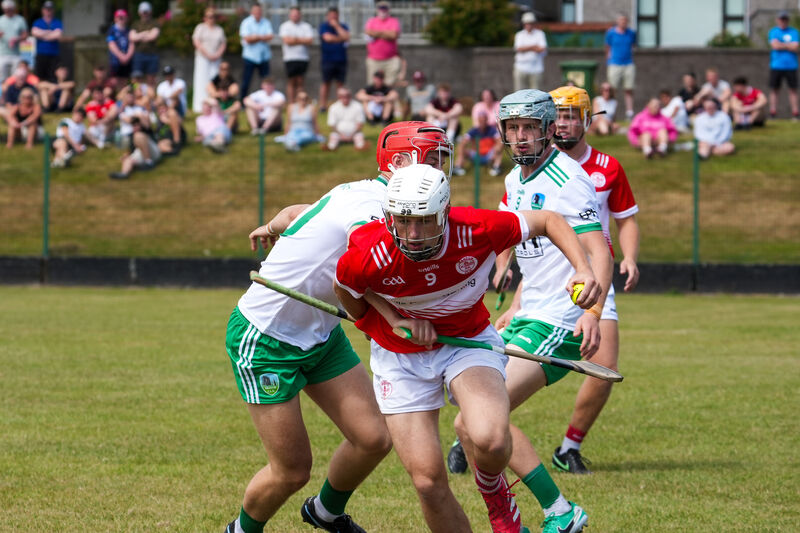Seán O’Reilly of Seandún breaks pasts Muskerry’s Cian O’Driscoll. Pic: by Noel Sweeney Seán O’Reilly of Seandún breaks pasts Muskerry’s Cian O’Driscoll. Pic: by Noel Sweeney