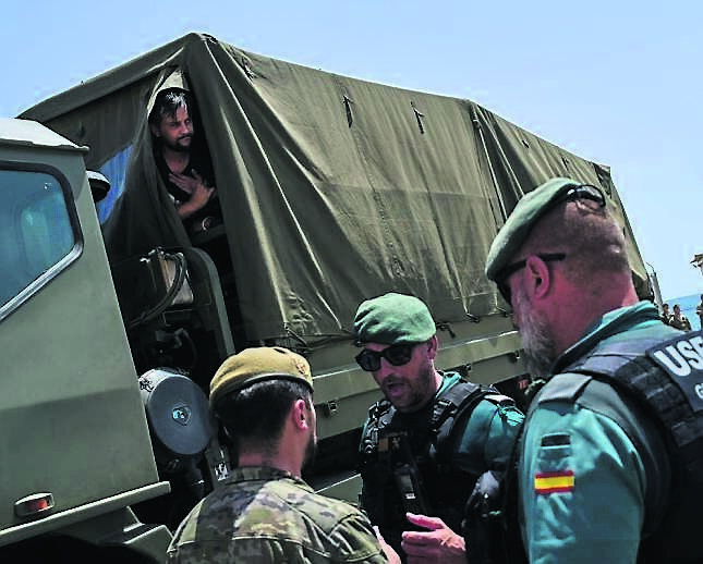 Migrants who crossed into Spain’s African territory of Ceuta being sent back to Morocco by the Spanish army on August 3. Picture: Bernat Armangue/AP Migrants who crossed into Spain’s African territory of Ceuta being sent back to Morocco by the Spanish army on August 3. Picture: Bernat Armangue/AP