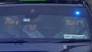 <p>Daniel Kinahan (back, right) leaving the Criminal Courts of Justice in Dublin, where he was remanded in custody charged with directing an organised crime group, after being extradited from Dubai. Picture date: Sunday August 9, 2026. PA Photo. Photo credit should read: Mark Marlow/PA Wire</p>