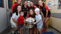 Ivan Yakubets with Darcie Reede with the O'Duffy Cup with Emma Murphy, Ashling Thompson, Avril Cashman and Méabh Cahalane 10/8/2