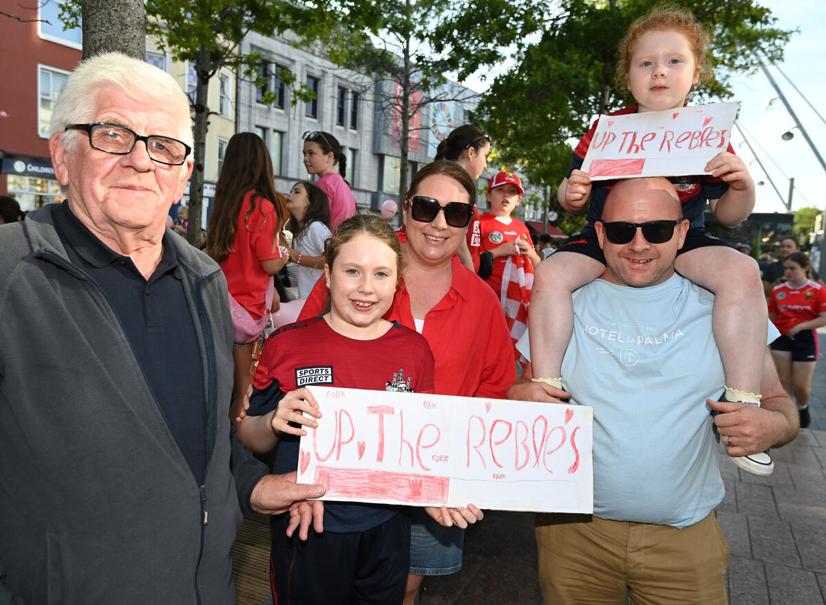 Cork supporters Tony O'Sullivan, Ballyphehane, with Freya, Vickey, Ger, and Grace Cronin from Midleton welcoming back the Cork All-Ireland Camogie winning team. Picture: Eddie O'Hare Cork supporters Tony O'Sullivan, Ballyphehane, with Freya, Vickey, Ger, and Grace Cronin from Midleton welcoming back the Cork All-Ireland Camogie winning team. Picture: Eddie O'Hare