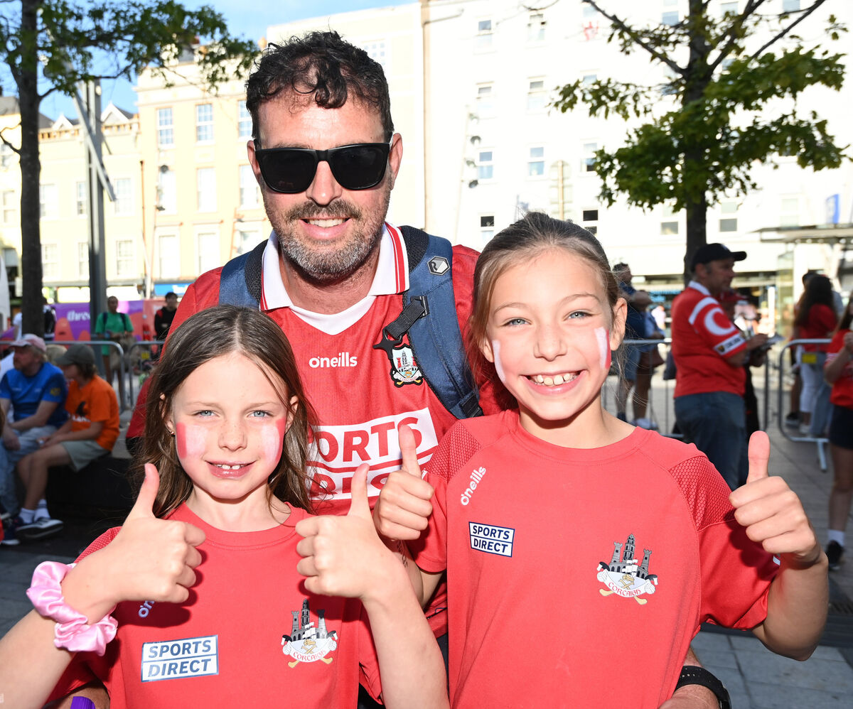 Cork supporters Billy Frost an his daughters Ali and Alex from Glounthaune welcoming home the Cork All-Ireland camogie winning team. Picture: Eddie O'Hare Cork supporters Billy Frost an his daughters Ali and Alex from Glounthaune welcoming home the Cork All-Ireland camogie winning team. Picture: Eddie O'Hare