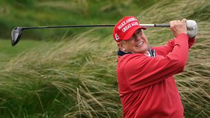 <p>US president Donald Trump playing golf at Trump International Golf Links &amp; Hotel in Doonbeg, Co Clare, during his 2023 visit to Ireland between his two presidential terms. File picture: PA</p>