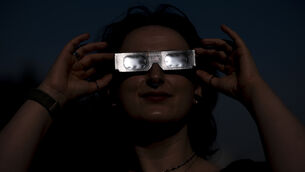<p>Planetarium astronomer Dr Carys Herbert demonstrates wearing Celestron solar eclipse glasses (Jordan Pettitt/PA)</p> <p>Planetarium astronomer Dr Carys Herbert demonstrates wearing Celestron solar eclipse glasses (Jordan Pettitt/PA)</p>