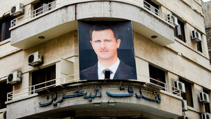 <p>A photo of Syria's ousted president Bashar al-Assad on a building in the capital city of Damascas before the outbreak of the civil war.</p> <p>A photo of Syria's ousted president Bashar al-Assad on a building in the capital city of Damascas before the outbreak of the civil war.</p>