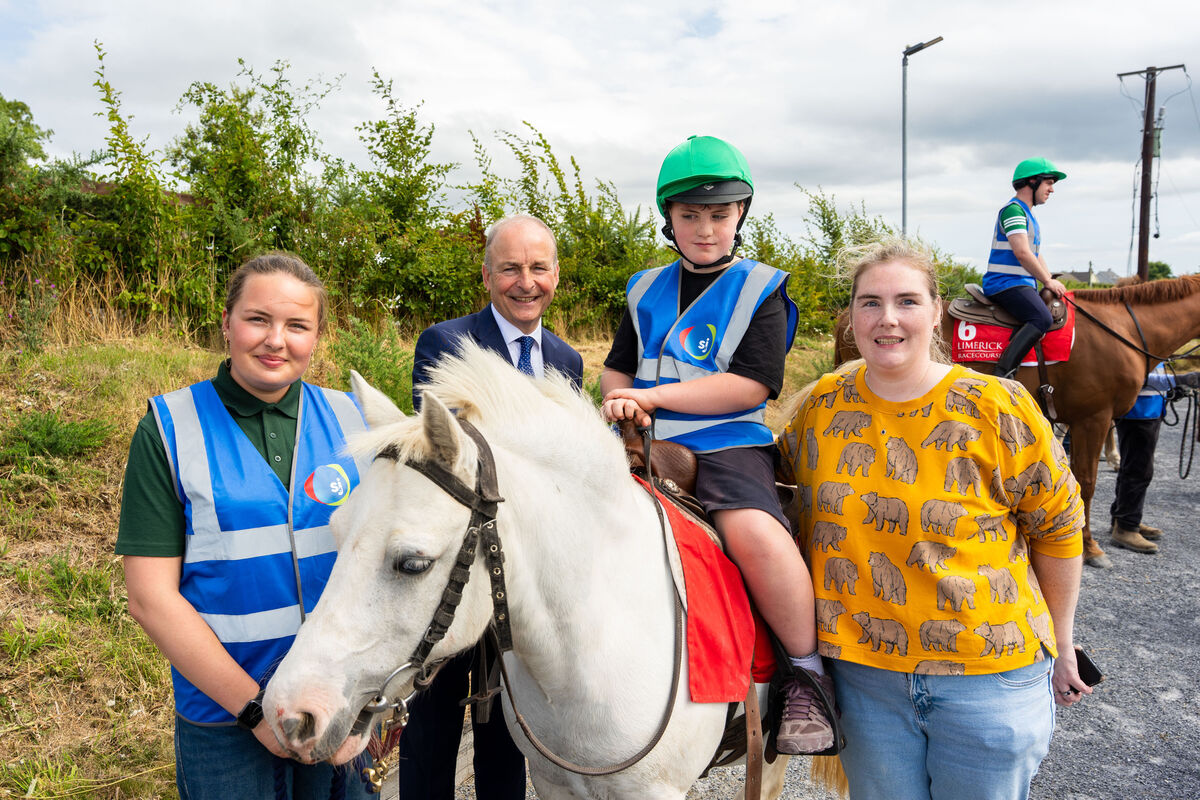 Equine support worker Hannah Brinck Meier, Taoiseach Micheál Martin, Angel the horse with Ryan Towning saddled on top, and Alexandra Towning. Mr Martin was speaking in Kanturk where he carried out a sod-turning ceremony to mark the start of the development of a three-prong project by St Joseph’s Foundation. Picture: Noel Sweeney Equine support worker Hannah Brinck Meier, Taoiseach Micheál Martin, Angel the horse with Ryan Towning saddled on top, and Alexandra Towning. Mr Martin was speaking in Kanturk where he carried out a sod-turning ceremony to mark the start of the development of a three-prong project by St Joseph’s Foundation. Picture: Noel Sweeney