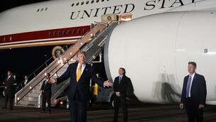 Surrounded by security, President Donald Trump switches planes at RAF Mildenhall in Suffolk (AP) Surrounded by security, President Donald Trump switches planes at RAF Mildenhall in Suffolk (AP)