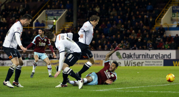 Burnley's Andre Gray goes down in the box after Keogh's challenge. Photo: Martin Rickett/PA Burnley's Andre Gray goes down in the box after Keogh's challenge. Photo: Martin Rickett/PA