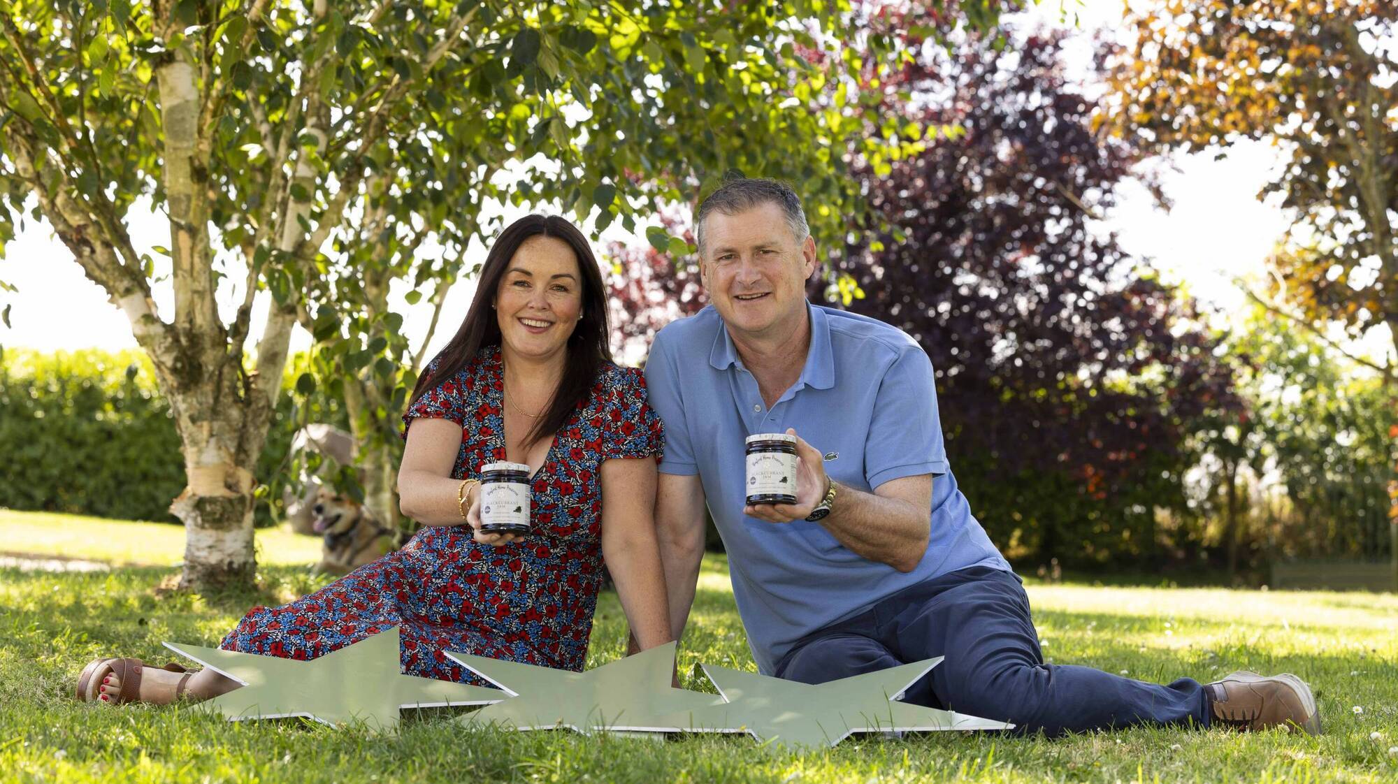 Laura and Tom Sinnott from Wexford Home Preserves in their garden with their blackcurrant jam and three stars.