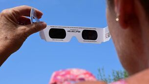 <p>A woman uses solar eclipse glasses for the total solar eclipse of August 12, 2026. Picture: Romain Doucelin / Hans Lucas.</p> <p>A woman uses solar eclipse glasses for the total solar eclipse of August 12, 2026. Picture: Romain Doucelin / Hans Lucas.</p>