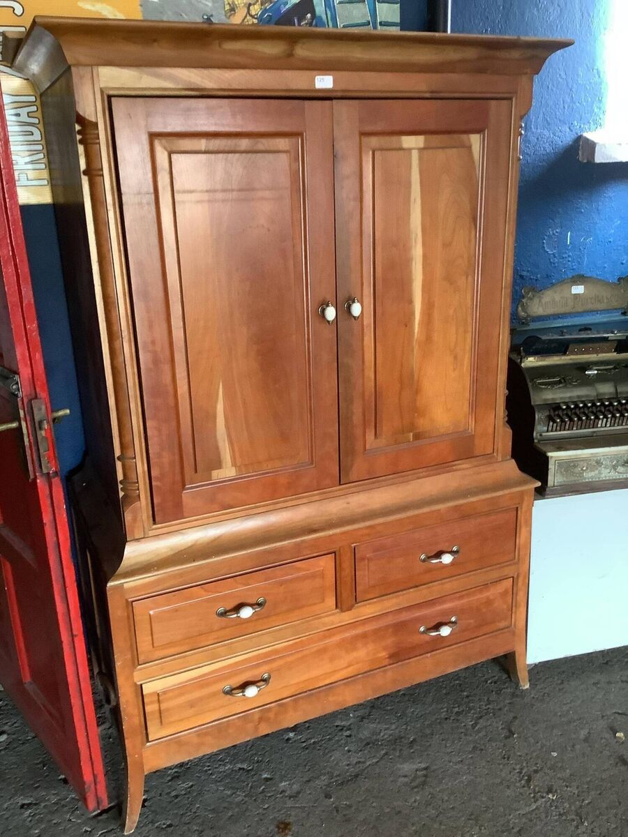 A Canadian cherrywood TV cabinet by Joseph Walsh.