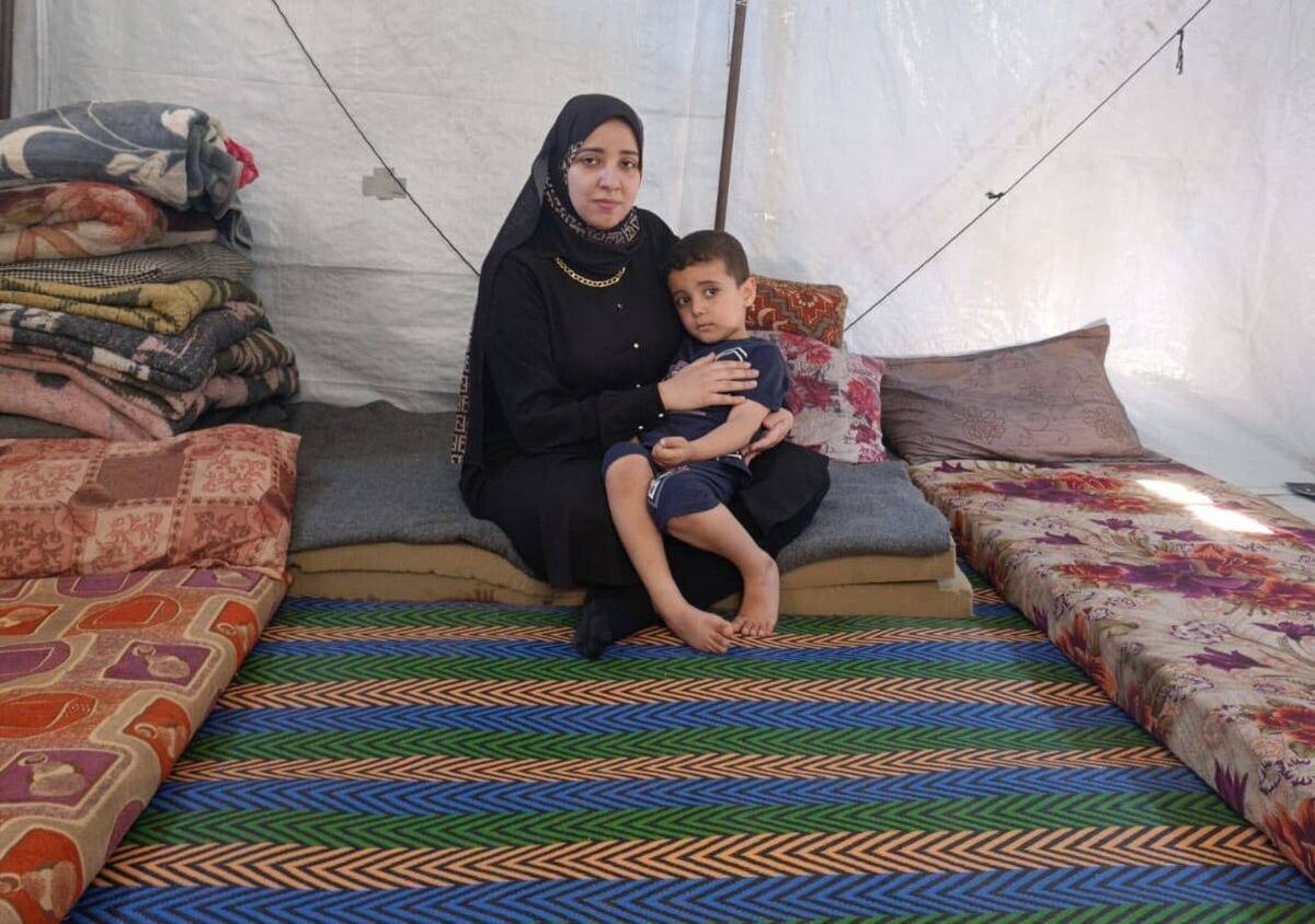 Zainab Eid and her four-year-old son Karim in the tented home in Gaza. Zainab Eid and her four-year-old son Karim in the tented home in Gaza.