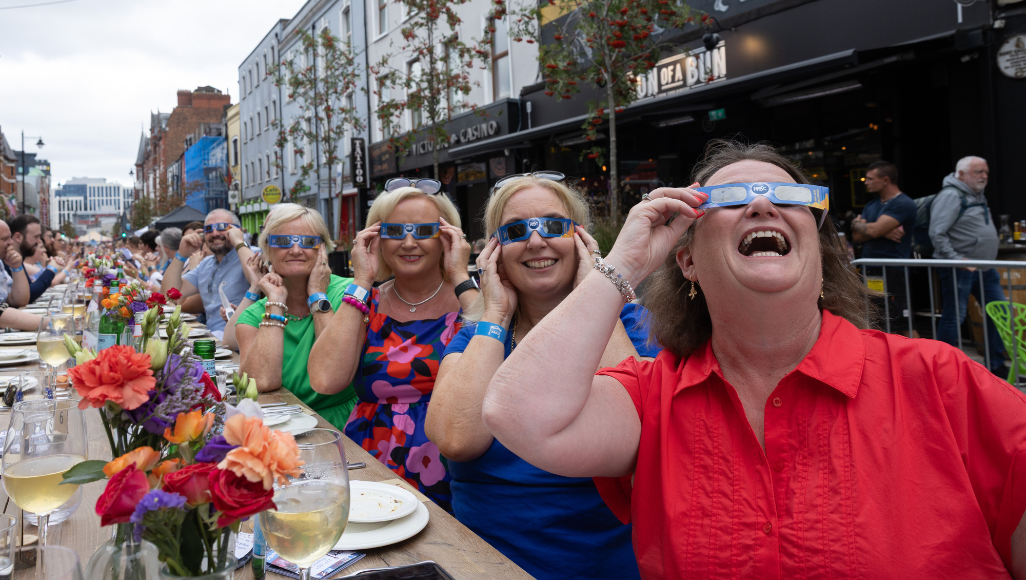 Treasa Dempsey, Douglas, Margaret Nagle, Glanmire, Deirdre Buckley, Douglas, and Siobhán Ó Nualláin, Tralee, wearing eclipse glasses at the VQ table at the opening night of the Cork on a Fork Festival. Picture: Darragh Kane