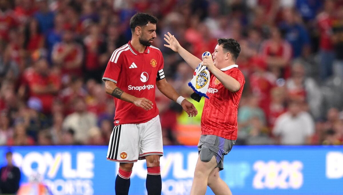 SPOT OF BOTHER: A pitch invader runs to Bruno Fernandes after he missed in the shootout. Pic: Stephen McCarthy/Sportsfile SPOT OF BOTHER: A pitch invader runs to Bruno Fernandes after he missed in the shootout. Pic: Stephen McCarthy/Sportsfile