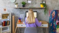 Caucasian young woman working on computer from home office