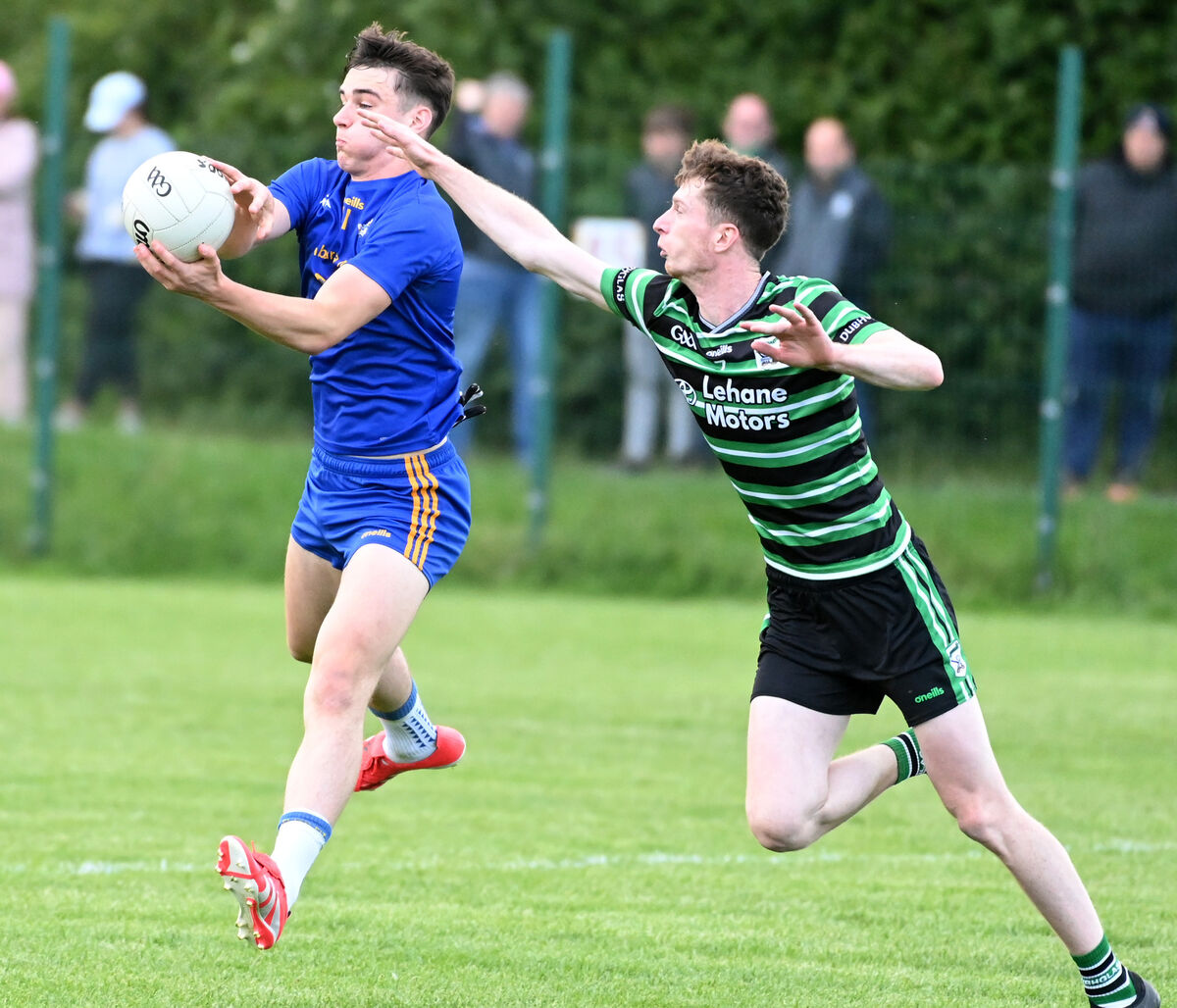 St. Finbarr's Ricky Barrett wins the ball from Douglas' Adam Cantwell. Pic: Eddie O'Hare St. Finbarr's Ricky Barrett wins the ball from Douglas' Adam Cantwell. Pic: Eddie O'Hare