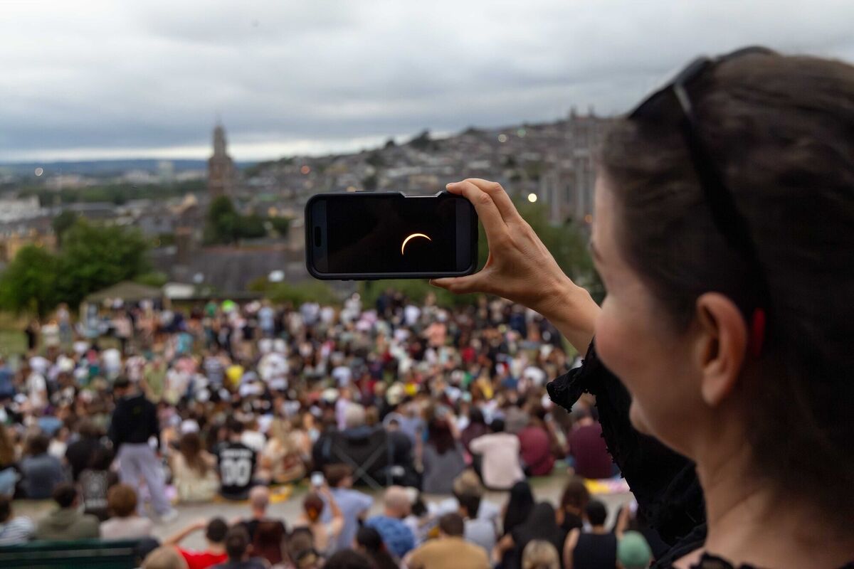 Alison Miles from North County Dublin watching the eclipse streamed live from Dublin, at Bell’s Field on Wednesday, 12 August 2026 as communities across Cork gathered with experts from MTU’s Blackrock Castle Observatory, hoping to experience a once-in-a-generation deep partial solar eclipse. Picture: Michael O'Sullivan / OSM PHOTO Alison Miles from North County Dublin watching the eclipse streamed live from Dublin, at Bell’s Field on Wednesday, 12 August 2026 as communities across Cork gathered with experts from MTU’s Blackrock Castle Observatory, hoping to experience a once-in-a-generation deep partial solar eclipse. Picture: Michael O'Sullivan / OSM PHOTO