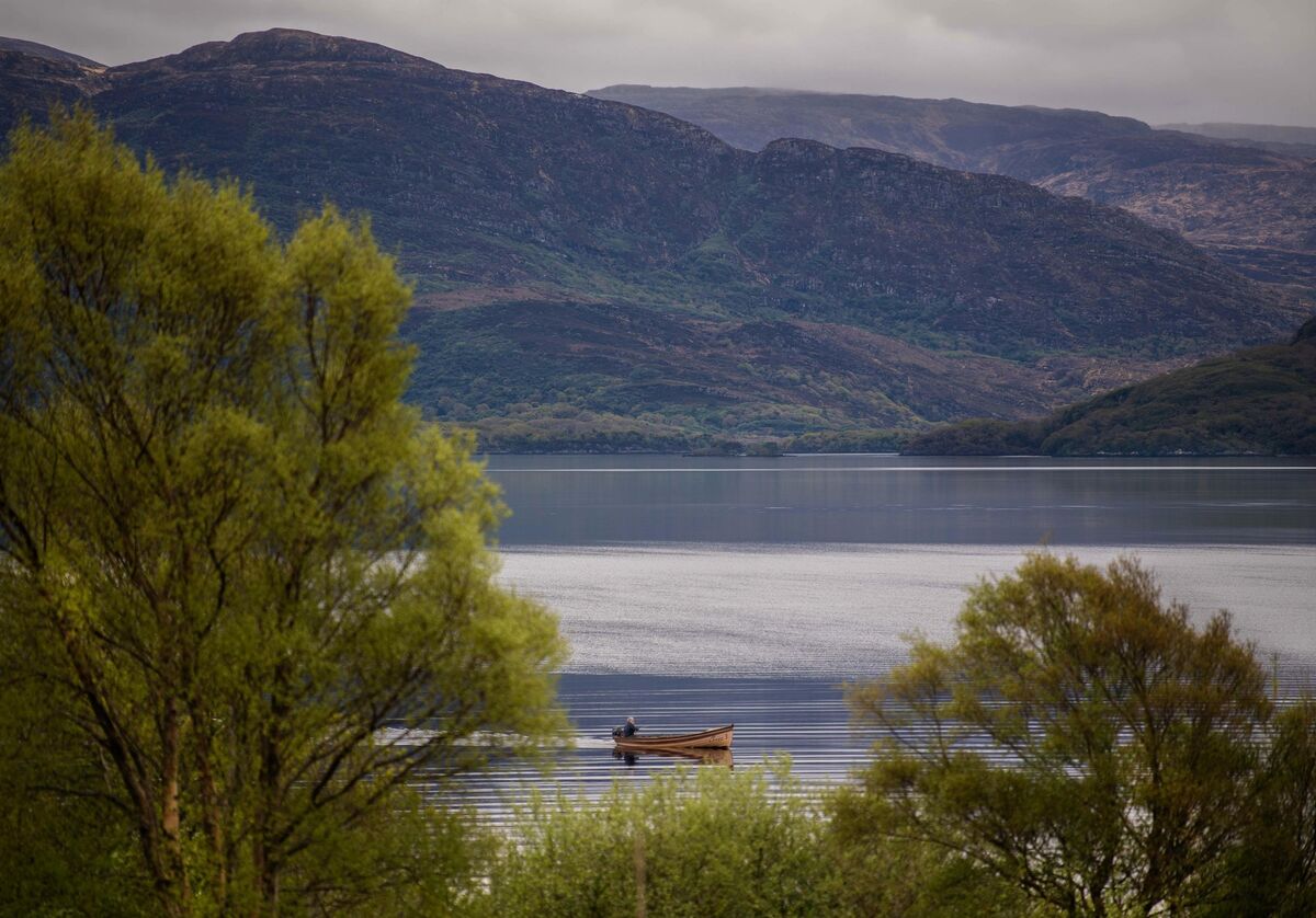 A fisherman pictured trawling then balmy waters for salmon on Lough Leane, Killarney. Picture: Don MacMonagle A fisherman pictured trawling then balmy waters for salmon on Lough Leane, Killarney. Picture: Don MacMonagle